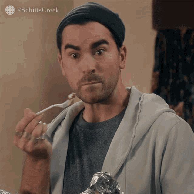 Eating Dan Levy GIF