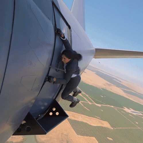 Hanging On The Side Of A Plane Michelle Khare GIF