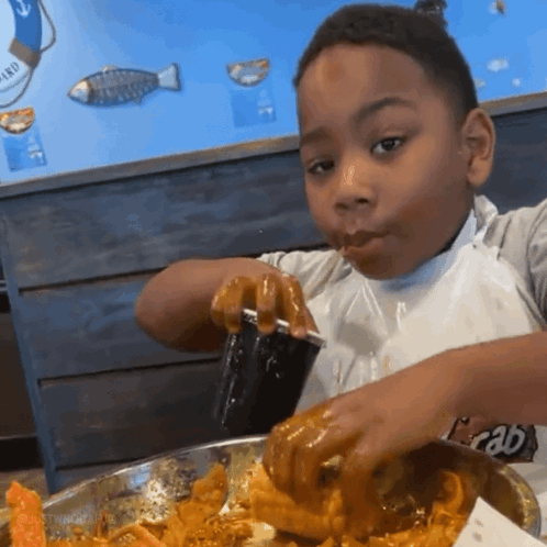 Kid Eating Kid Drinking In Black Cup GIF