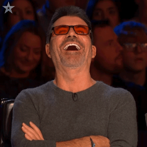 Laughing Simon Cowell GIF