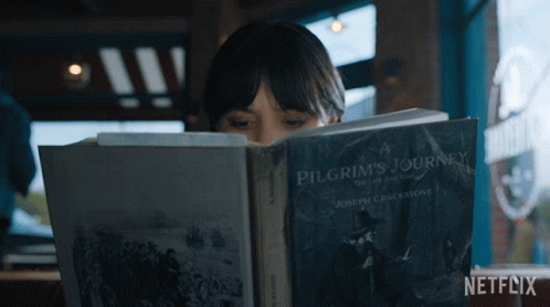 Reading A Book Wednesday Addams GIF