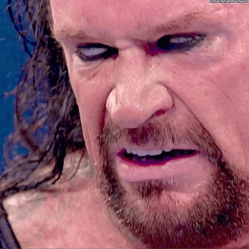 The Undertaker Rolls Eyes GIF