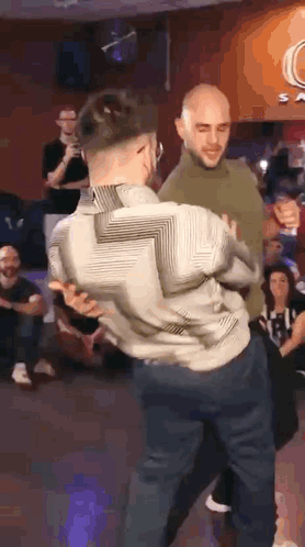 Two Men Dancing Rolerotation Bachata GIF