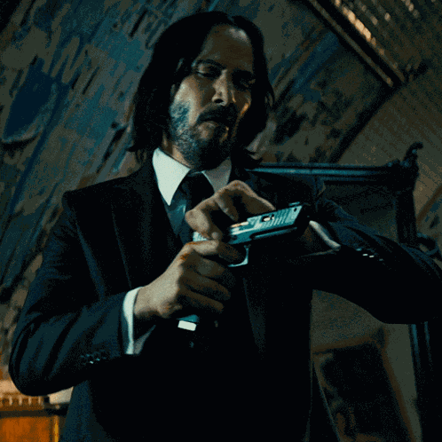 Cocking Pistol John Wick GIF