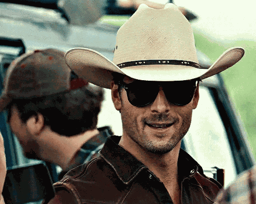 Glen Powell Cowboy Hat Twisters Hat Tip GIF