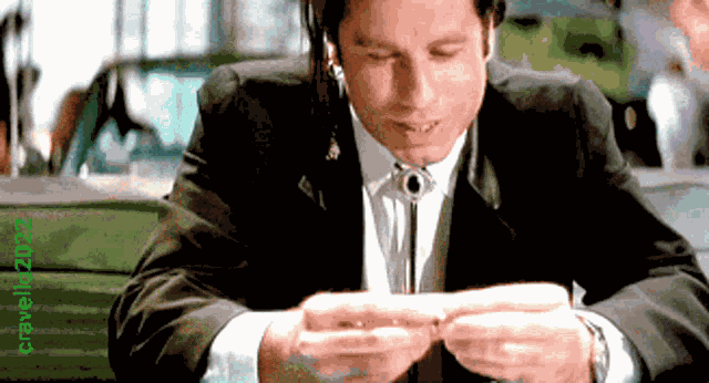 John Travolta Rolling A Joint GIF