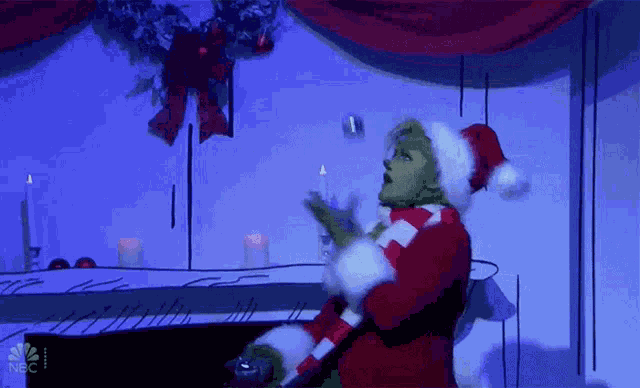 Juggle Grinch GIF