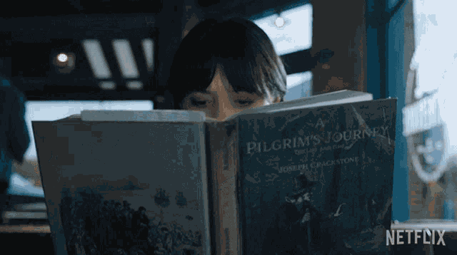 Reading A Book Wednesday Addams GIF