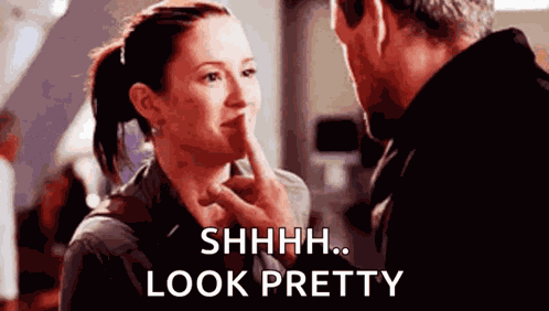 Shh Smiling GIF