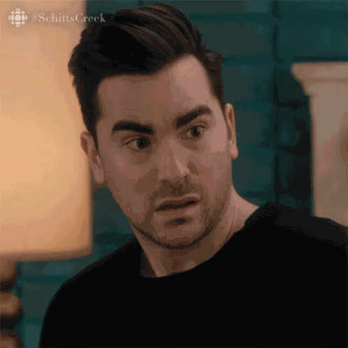 Shocked Dan Levy GIF