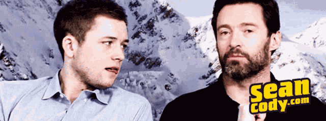 Taron Egerton Hugh Jackman GIF