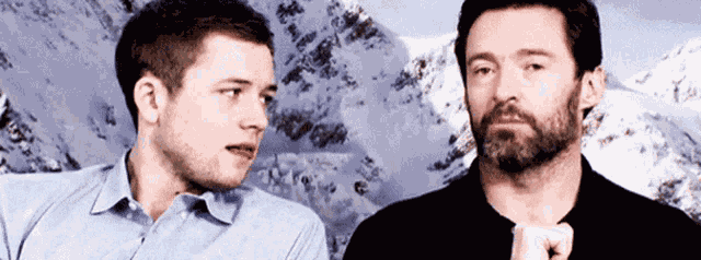 Taron Egerton Hugh Jackman GIF