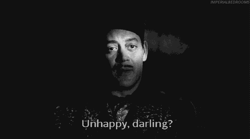Unhappy Morticia Addams GIF